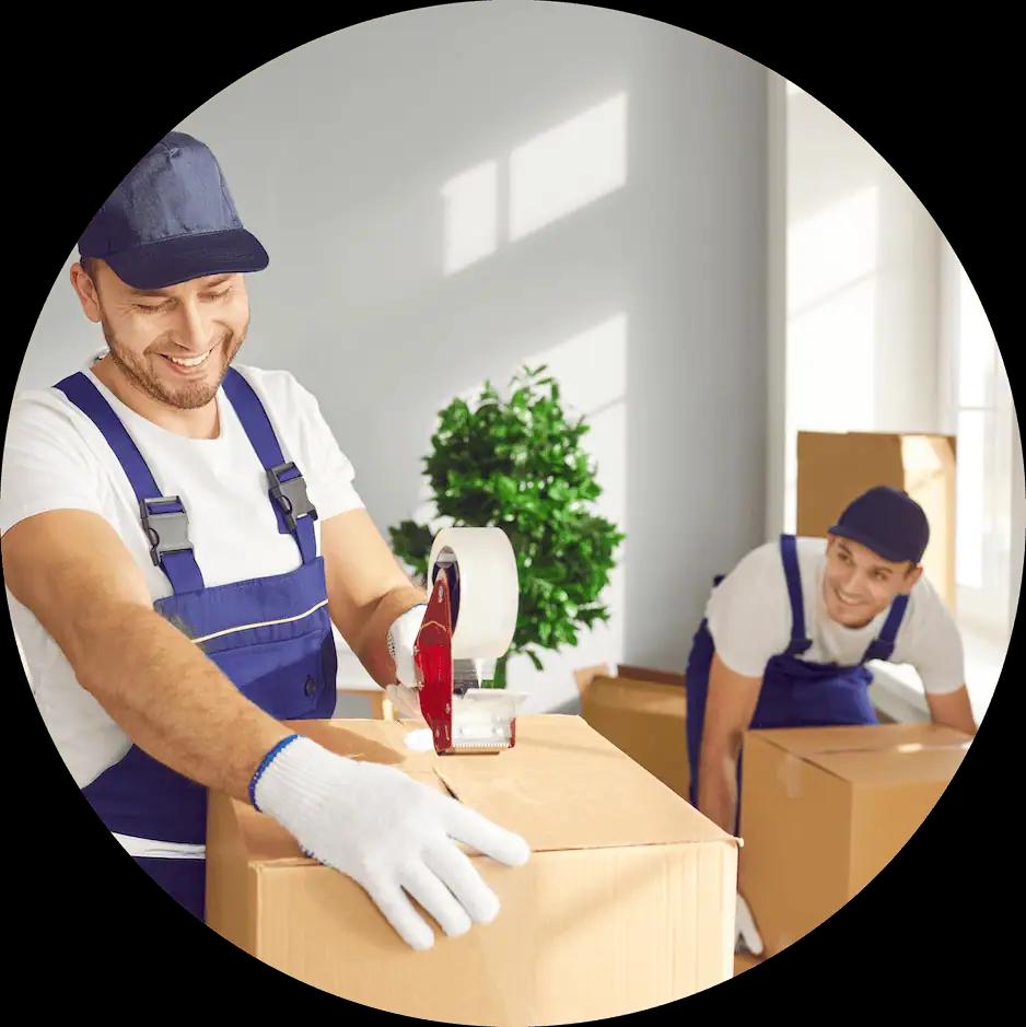 Two professional movers packing a room