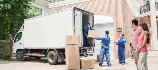 Workers loading a moving truck